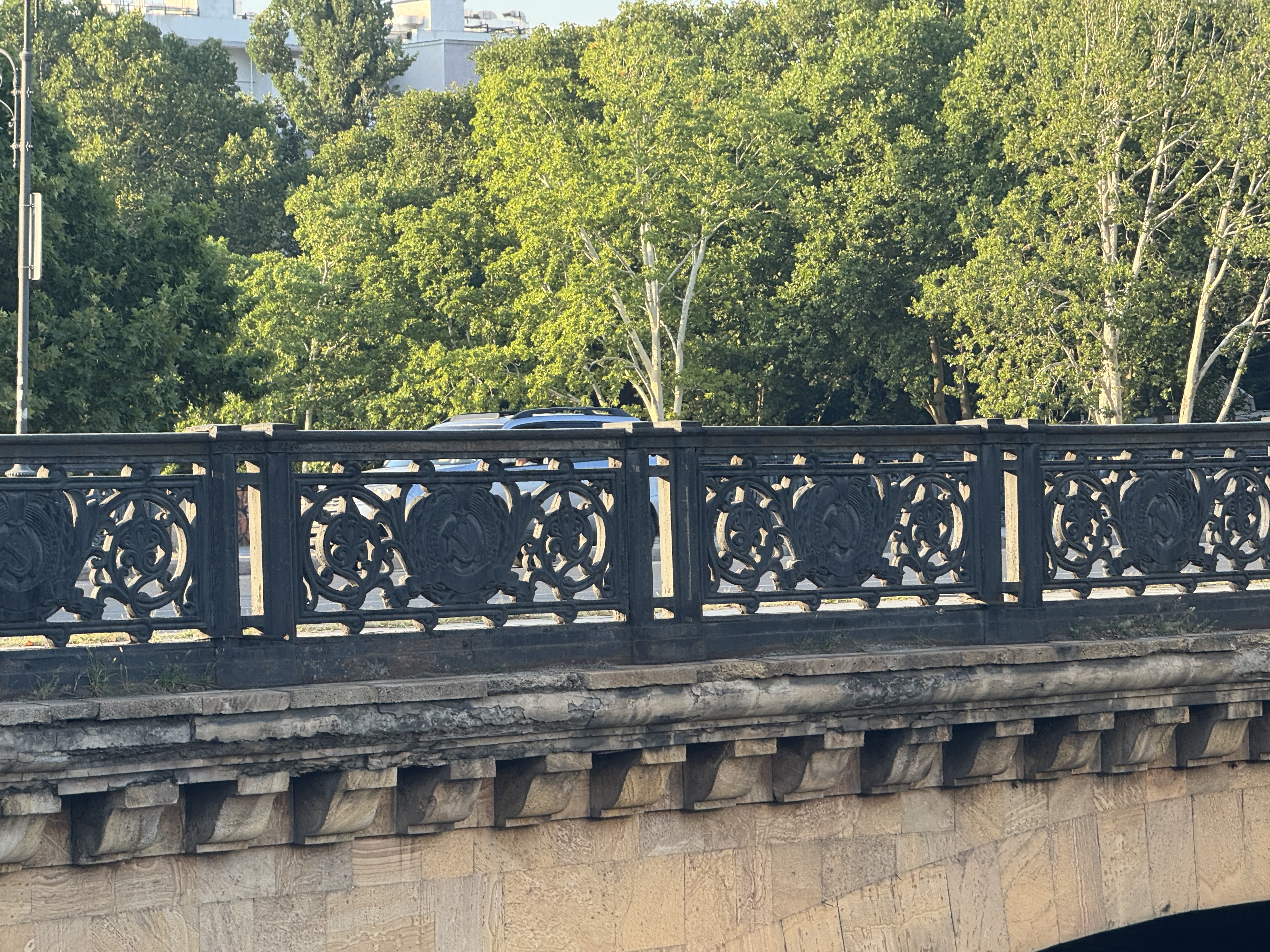 Galaktion Tabidze bridge railing with Soviet ornaments spanning the Kura River in Tbilisi.
