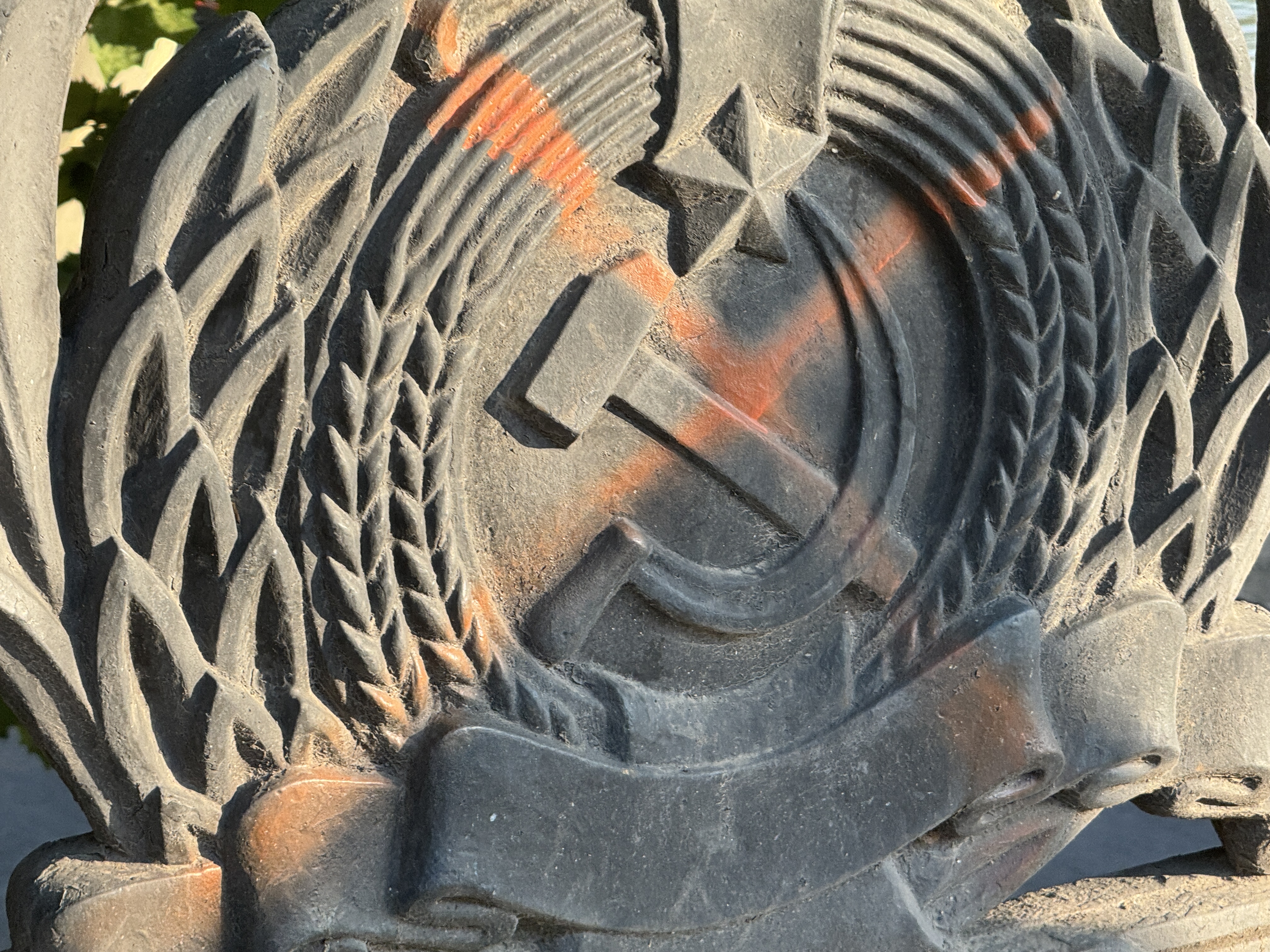Detail of the sheaf-wrapped Soviet crest cast in iron on a Tbilisi bridge.